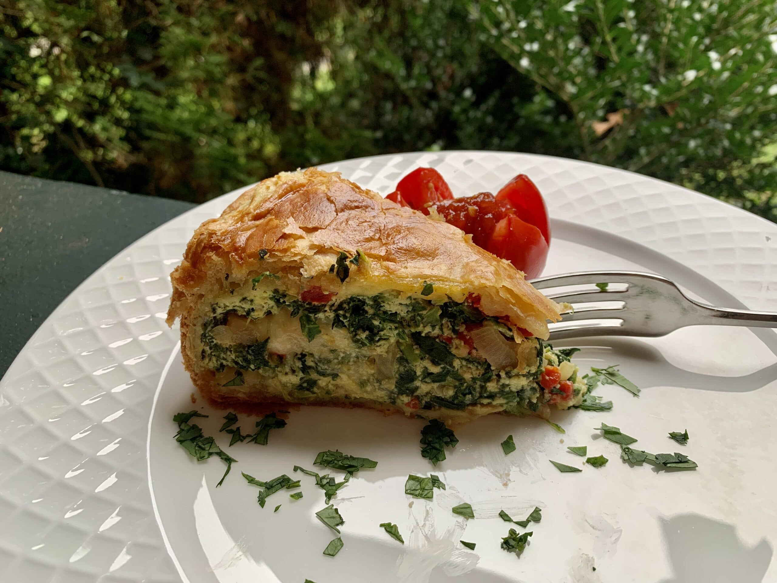 spinach ricotta puff on plate with fork